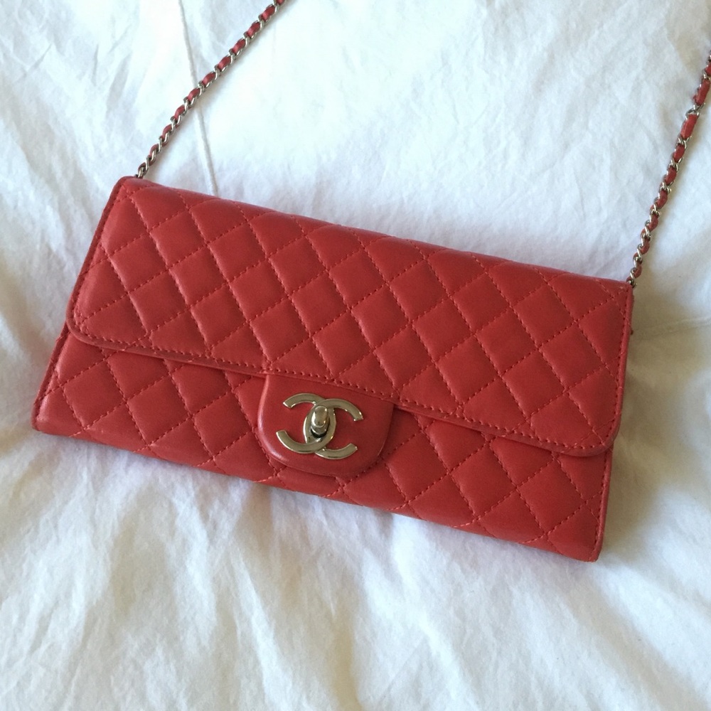 Beautiful red Chanel clutch wallet with strap
